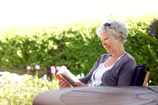 Woman outside reading a book